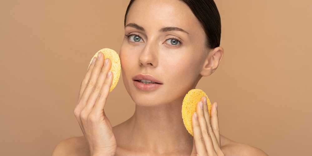 How do AHAs exfoliate the skin?